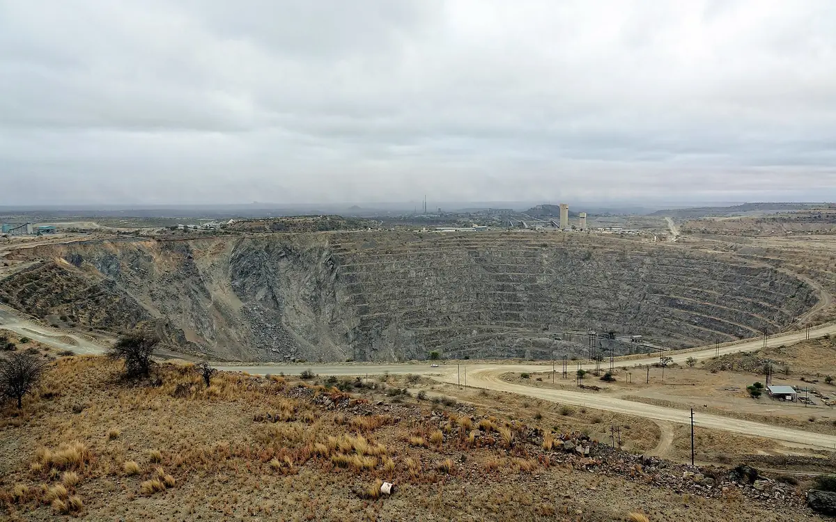 An open-pit mine seen from its rim, terraces running down into the pit.